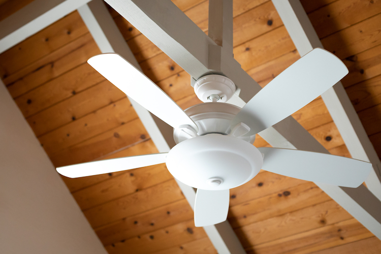 White Ceiling Fan Hanging from White Beam on Ceiling | Cates Heating & Cooling