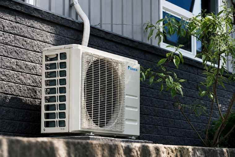 Outdoor AC unit installed by a trusted heating & cooling company