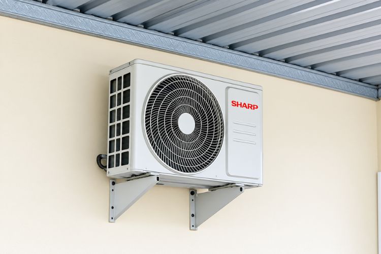 Outdoor HVAC in Lenexa installed on a building wall