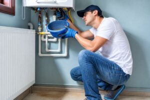 Residential furnace inspection showing a technician evaluating furnace repair in Lenexa KS.
